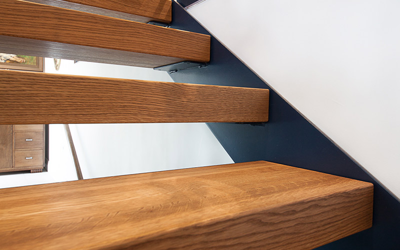 Lateralis stairs – steel side plate stringers painted black with 80mm American Oak treads.
